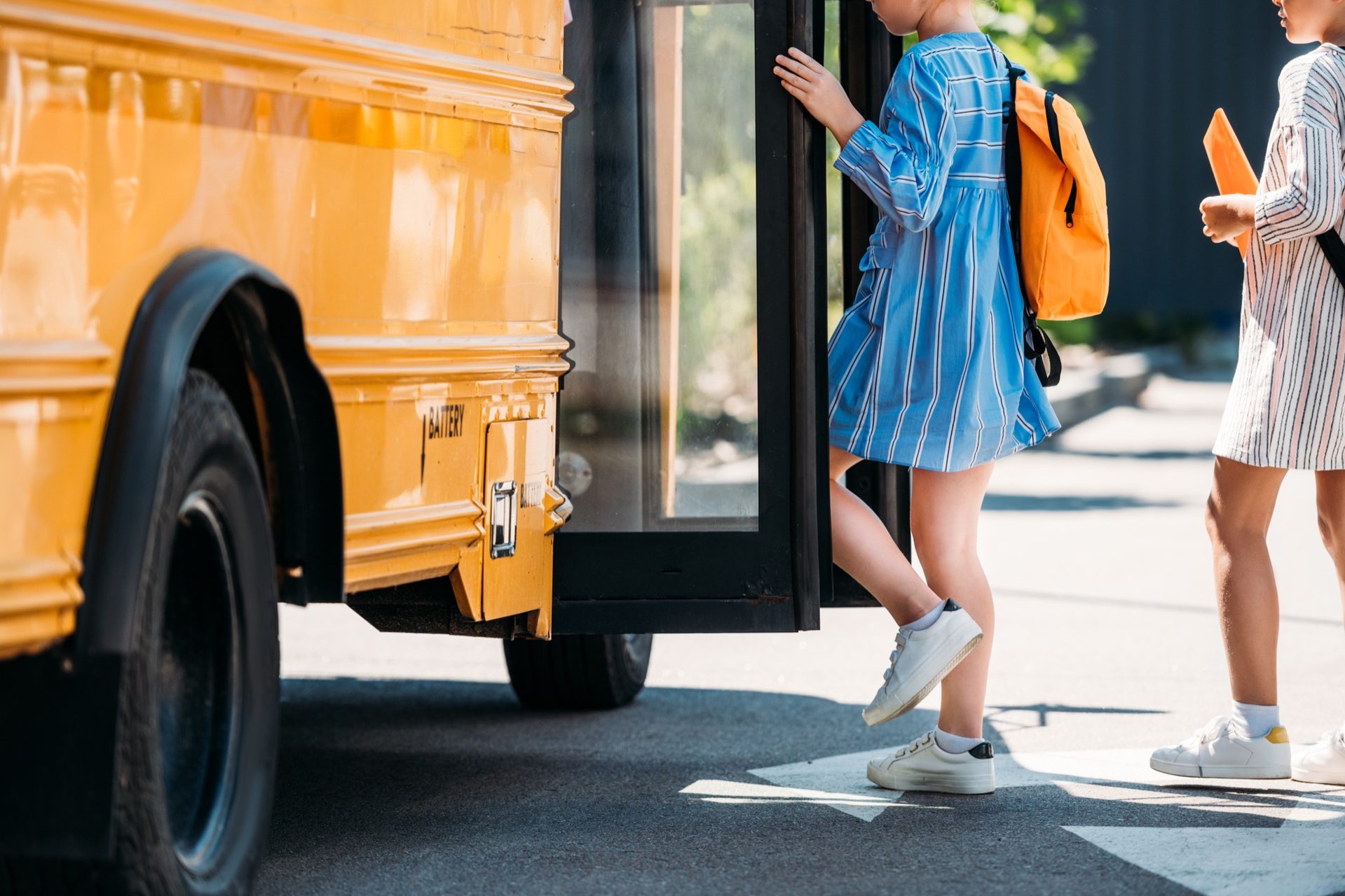 Students boarding a school bus