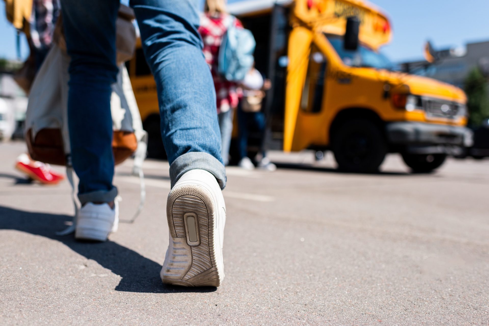 Students boarding a school bus